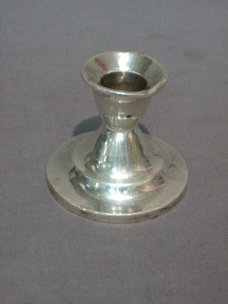 A "silver" stub shaped candlestick 2", 2 silver handled button hooks and a silver handled shoe horn