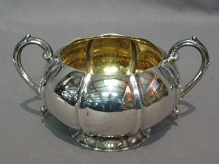 A William IV circular melon shaped silver twin handled sugar bowl raised on a spreading foot, London 1829, 9 ozs