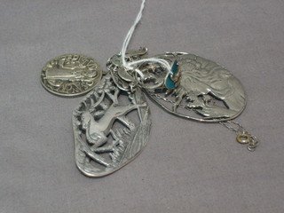 A silver and enamelled ring, 2 pierced silver Art Nouveau style brooches, a silver religious pendant and a silver pendant set turquoise