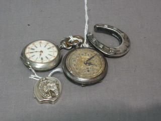 A silver cased open faced fob watch, a gun metal open faced fob watch, a silver locket in the form of a horseshoe and a Victorian silver brooch in the form of a horse shoe