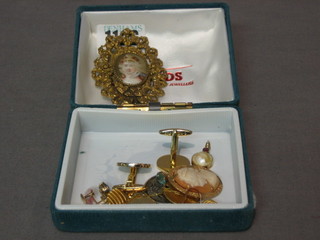 A small collection of costume jewellery including a pair of Dior cufflinks, earrings etc