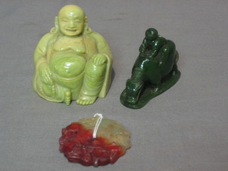 A circular hardstone pendant decorated hares 2", a  hardstone figure of a boy with Buffalo 2" and a green hardstone figure of a seated Buddha 2"