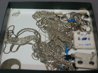 A collection various silver costume jewellery including rings, chains etc