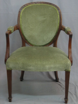 A Georgian style mahogany open arm library chair raised on square tapering supports