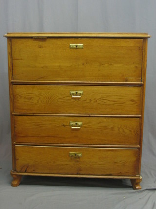 A 19th Century honey oak lozenge shaped Biedermeire escritoire chest, the fall front revealing a fitted interior above 3 long drawers 40"