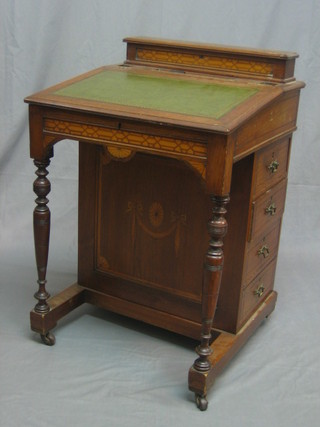An Edwardian walnut Davenport desk with hinged stationery box to the back, the writing surface inset tooled green leather, the pedestal fitted 4 long drawers, raised on turned supports 22"