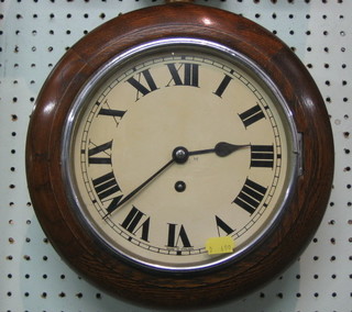 An 8 day wall clock with 7 1/2" dial contained in a circular oak case 