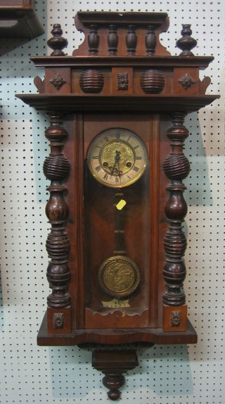 An Art Nouveau Vienna style regulator the 5" dial with Roman numerals contained in a walnut case