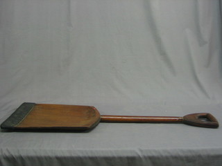 A large wooden malt shovel