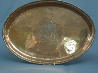 An oval Art Nouveau planished copper tea tray 22"
