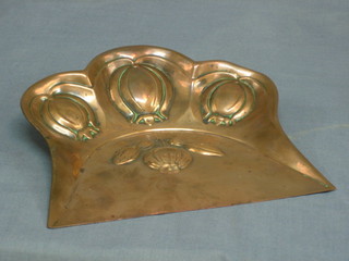 An Art Nouveau embossed copper crumb tray 9"