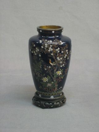 A 19th/20th Century black ground cloisonne vase decorated birds amidst trees 11"