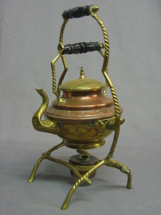 A copper and brass tea kettle complete with burner