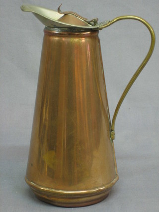 An Art Nouveau copper insulated jug of waisted form, base marked Made in England W, with pick and 2 hammer mark WAFB 10", (base dented)