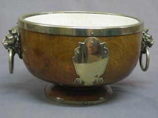 A turned oak fruit bowl with silver plated mounts and ceramic liner 10"