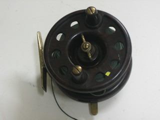 A Modern Arms brown Bakelite centre pin fishing reel  3"