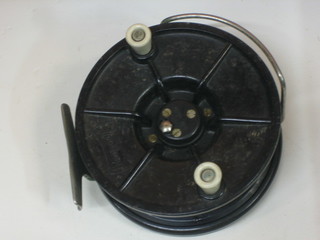 An Academy black Bakelite centre pin fishing reel 5"