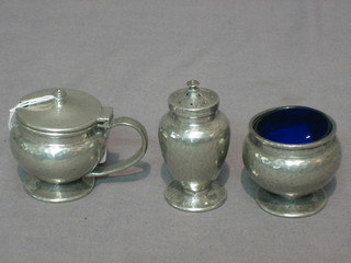 A Tudric Art Deco 3 piece planished pewter condiment set, the base marked Tudric English Pewter Liberty & Co 01079
