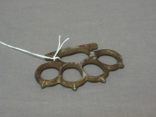 A 19th Century cast iron knuckle duster