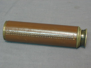A 3 draw pocket telescope by Britannic contained in a brass case