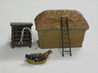 A Britons chicken coop containing 2 chickens, a cat's bed with 2 cats and a hay stack complete with ladder 