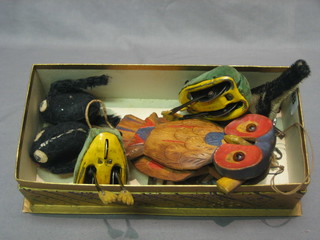 2 Schuco clockwork figures of frogs 2", a clockwork figure of a bird, 2 clockwork fabric figures of goldfish? and a wooden figure of an owl