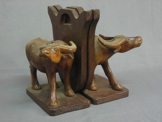 A pair of carved Eastern book ends in the form of Buffaloes 13"