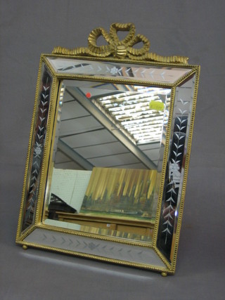 An etched and bevelled easel mirror contained in a decorative gilt frame 13" x 11"