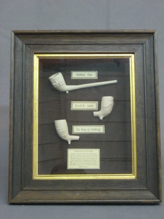 3 reproduction clay pipes contained in a frame 9" x 8"