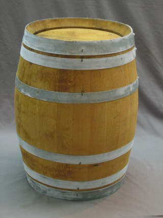 A coopered wooden barrel 23"