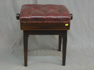 A "rosewood" rectangular adjustable piano stool with upholstered buttoned leather seat, raised on square tapering supports 17"