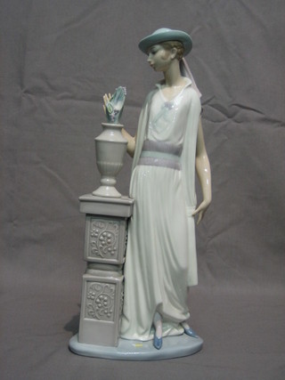 A Lladro figure of a standing lady, base impressed E230 13"