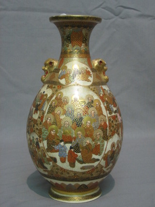 A 19th Century Satsuma club shaped vase with  mask handles to the sides, decorated court figures, the base with circular and rectangular seal mark 10"