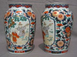 A pair of 19th Century Japanese Imari porcelain vases decorated figures 10"