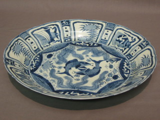 A 17th Century circular Oriental blue and white charger decorated fish 12"