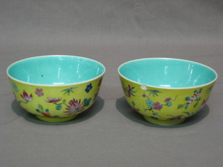 A pair of 19th Century Oriental yellow glazed bowls with floral decoration and turquoise interiors, the base with 6 character mark 4 1/2" (1 chipped)