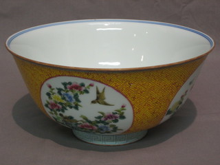 An 18th Century Oriental porcelain bowl with red bamboo effect exterior decorated panels with floral decoration, raised on a circular spreading foot, the base with blue seal mark 8" 