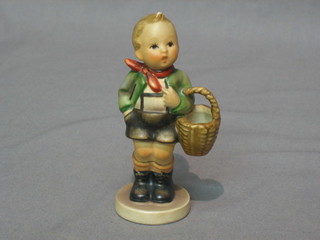 A Goebel figure of a boy with basket 3"