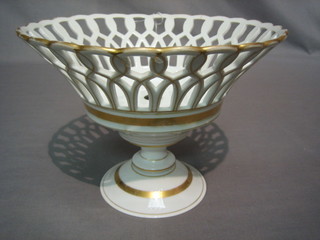A 19th Century porcelain basket work pedestal fruit bowl with gilt banding 9" (slight crack)