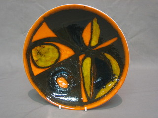 A circular Poole Pottery Atomic orange plate, the base marked Poole England 3, 8"