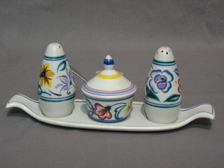 A Poole Pottery 4 piece condiment with twin handled tray salt, mustard and pepper pot