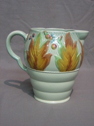 A Clarice Cliff Newport pottery green glazed jug with floral decoration, base marked Clarice Cliff Newport 41A 7"