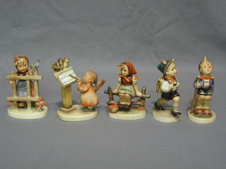 5 various Hummel figures - boy walking, seated girl, cherub with music, walking boy and girl by a fence - all f,