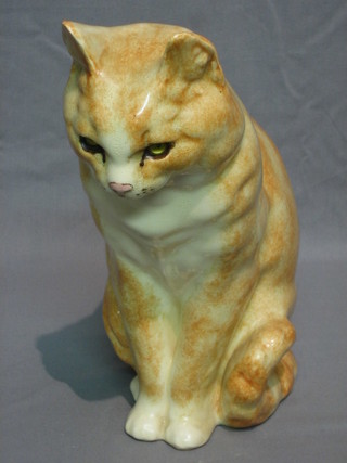 A pottery figure of a seated cat 11"