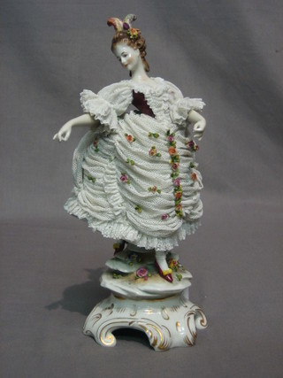 A Dresden porcelain figure of a standing Crinoline lady 12"