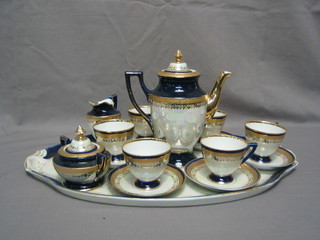 A 16 piece Continental Cabaret coffee set with blue gilt and lustre decoration comprising 19" twin handled tray, 8" coffee pot, twin handled sucrier and cover, cream jug, 6 cups and saucers