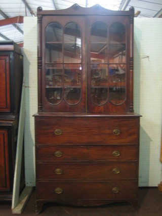 A Georgian mahogany secretaire bookcase, the upper section enclosed by astragal glazed 