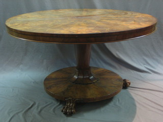 A William IV Circular mahogany snap top breakfast table raised on a turned column with spreading foot ending in paw feet 59" (split to top)