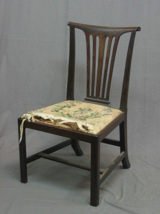 A 19th Century mahogany Hepplewhite style stick and bar back dining chair with drop in seat, raised on square supports