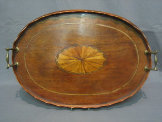 A 19th Century oval inlaid mahogany twin handled tea tray 22"